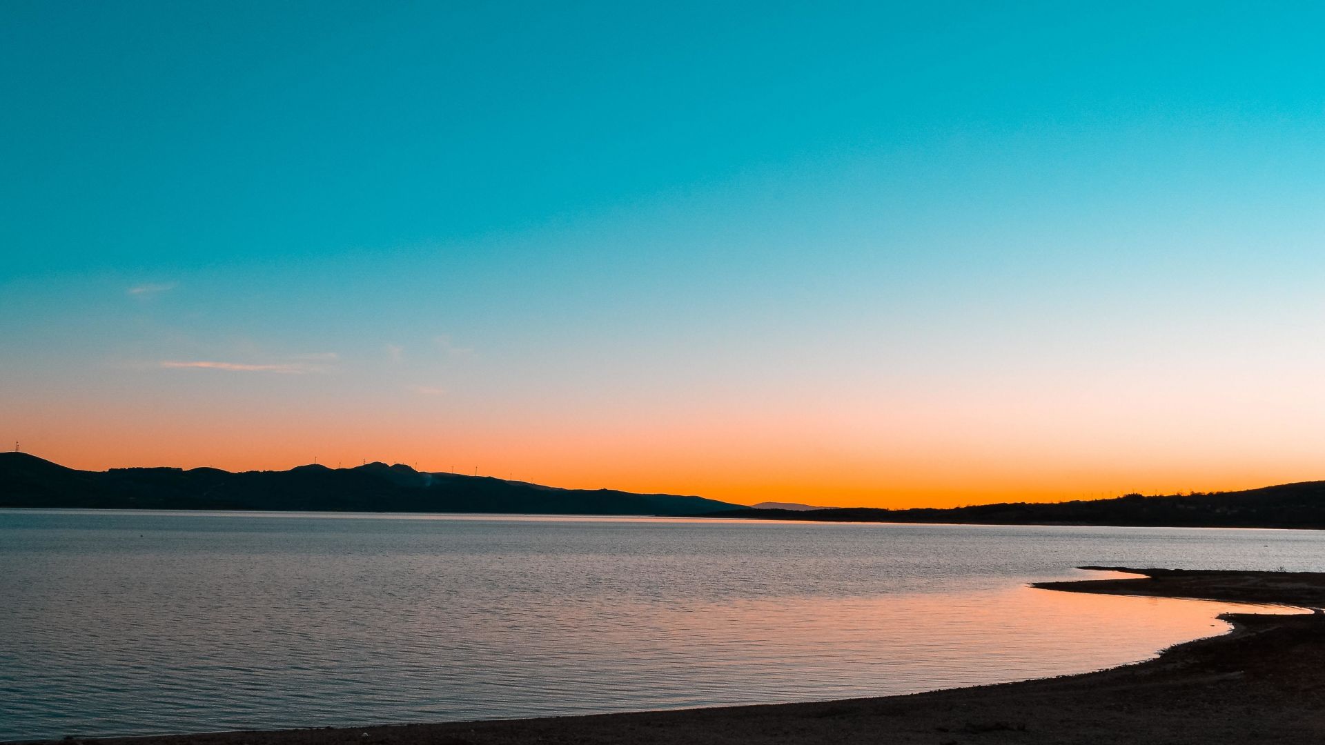 A Calm Lake At Sunset Wallpapers