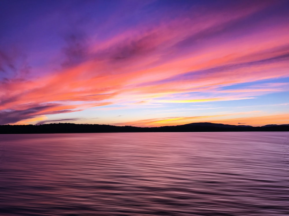 A Calm Lake At Sunset Wallpapers