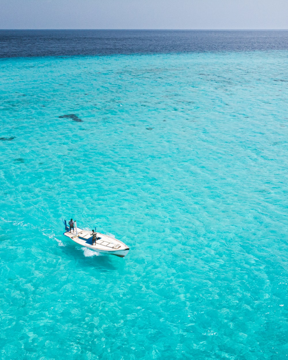 Boat In Blue Sea Water Wallpapers