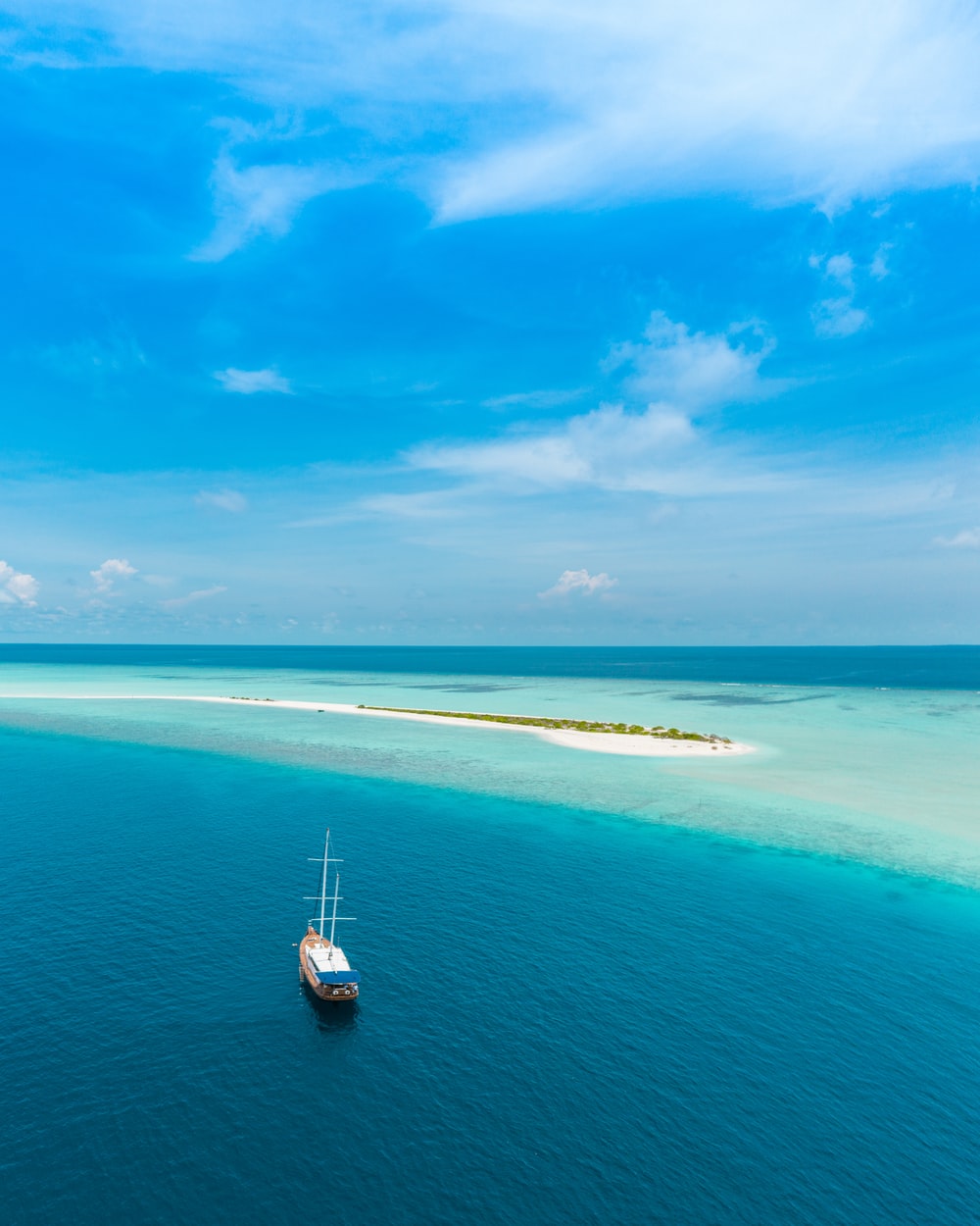 Boat In Blue Sea Water Wallpapers