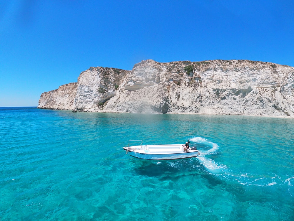 Boat In Blue Sea Water Wallpapers