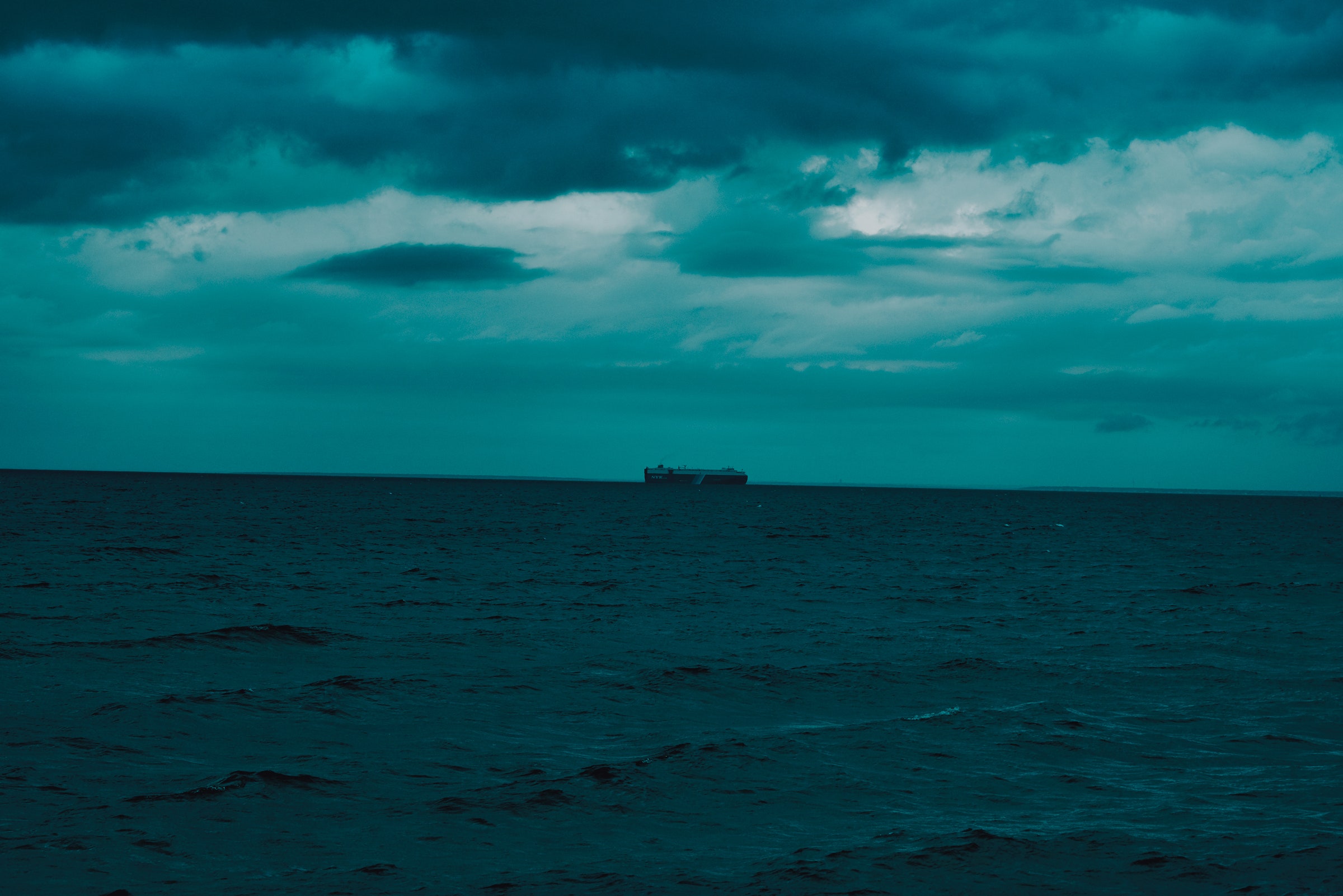 Dark Evening Blue Cloudy Alone Boat In Ocean Wallpapers