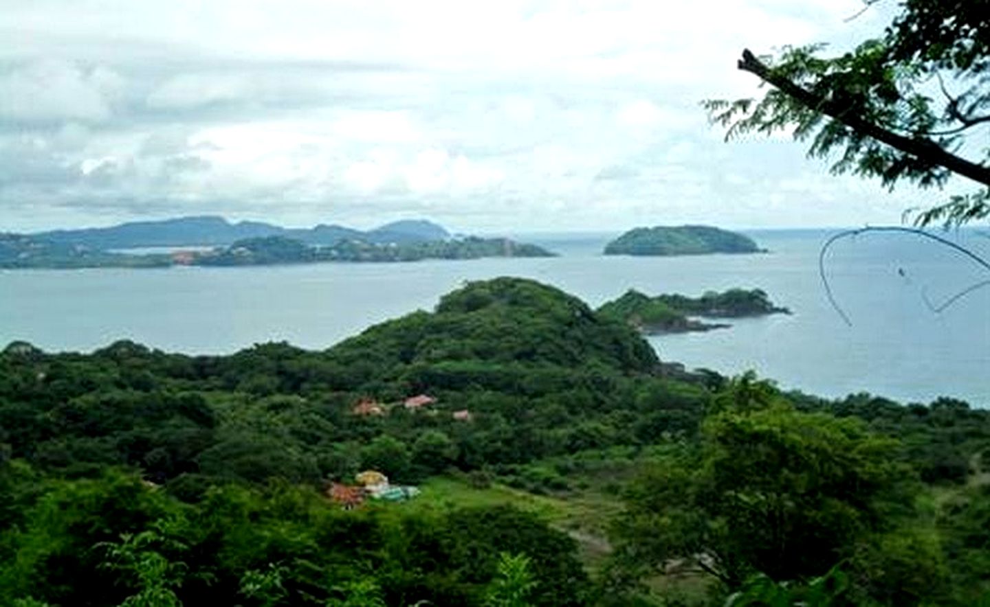 Green Trees Covered Mountains Surrounded By Occean Wallpapers