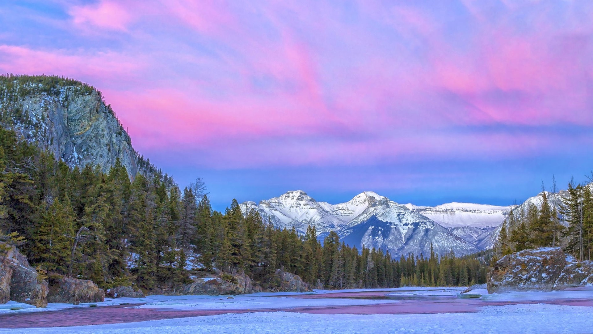 Mountain With Clouds In Background Of Blue And Purple Sky