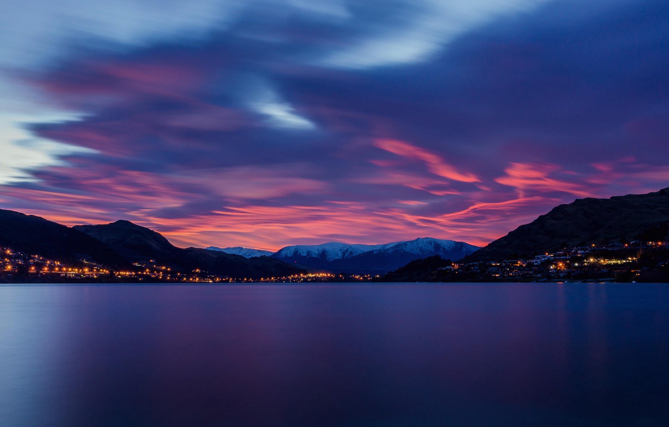 Mountain With Clouds In Background Of Blue And Purple Sky