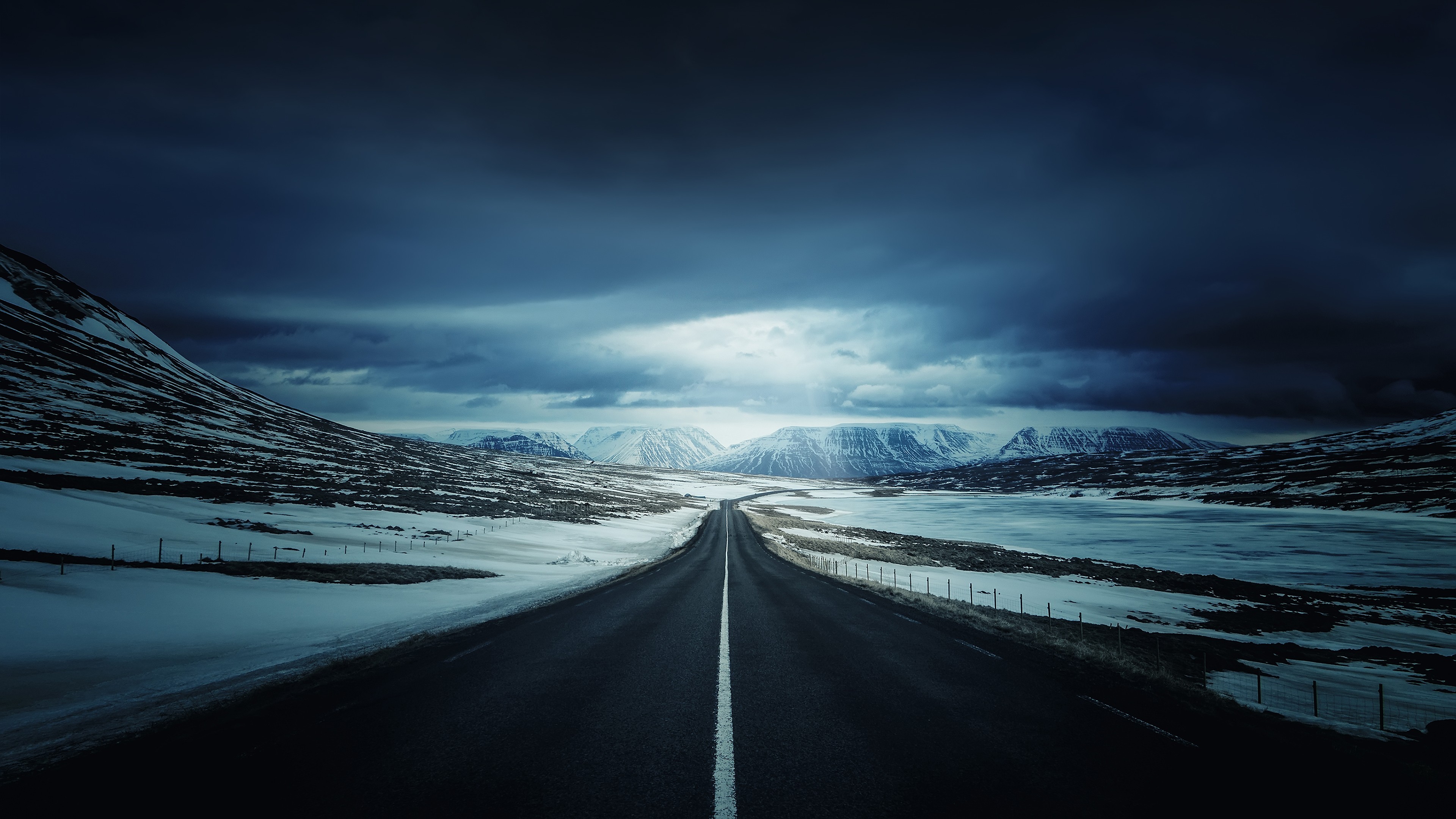 Road With Background Of Mountains And Clouds