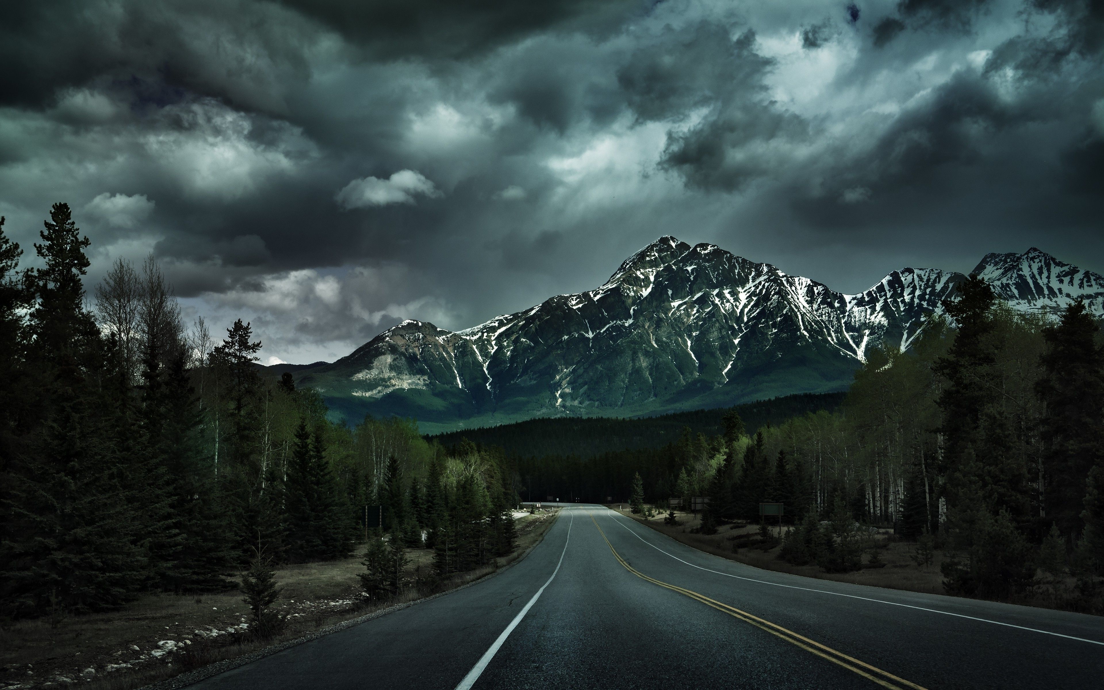 Road With Background Of Mountains And Clouds