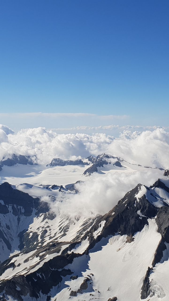 Snow Covered Mountains Under Black Cloudy Sky Wallpapers