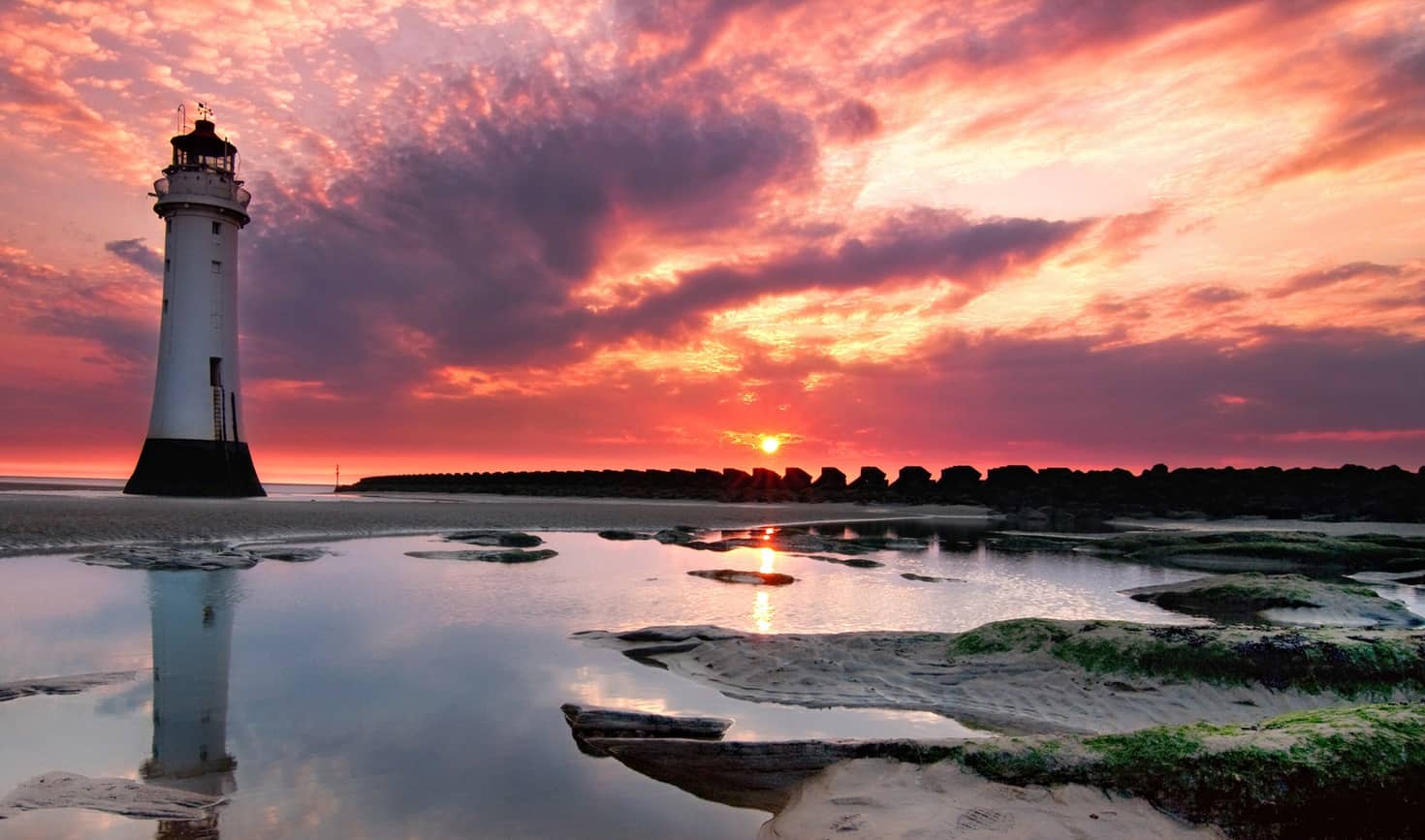 Surreal Sunrise Near Ocean Lighthouse Wallpapers