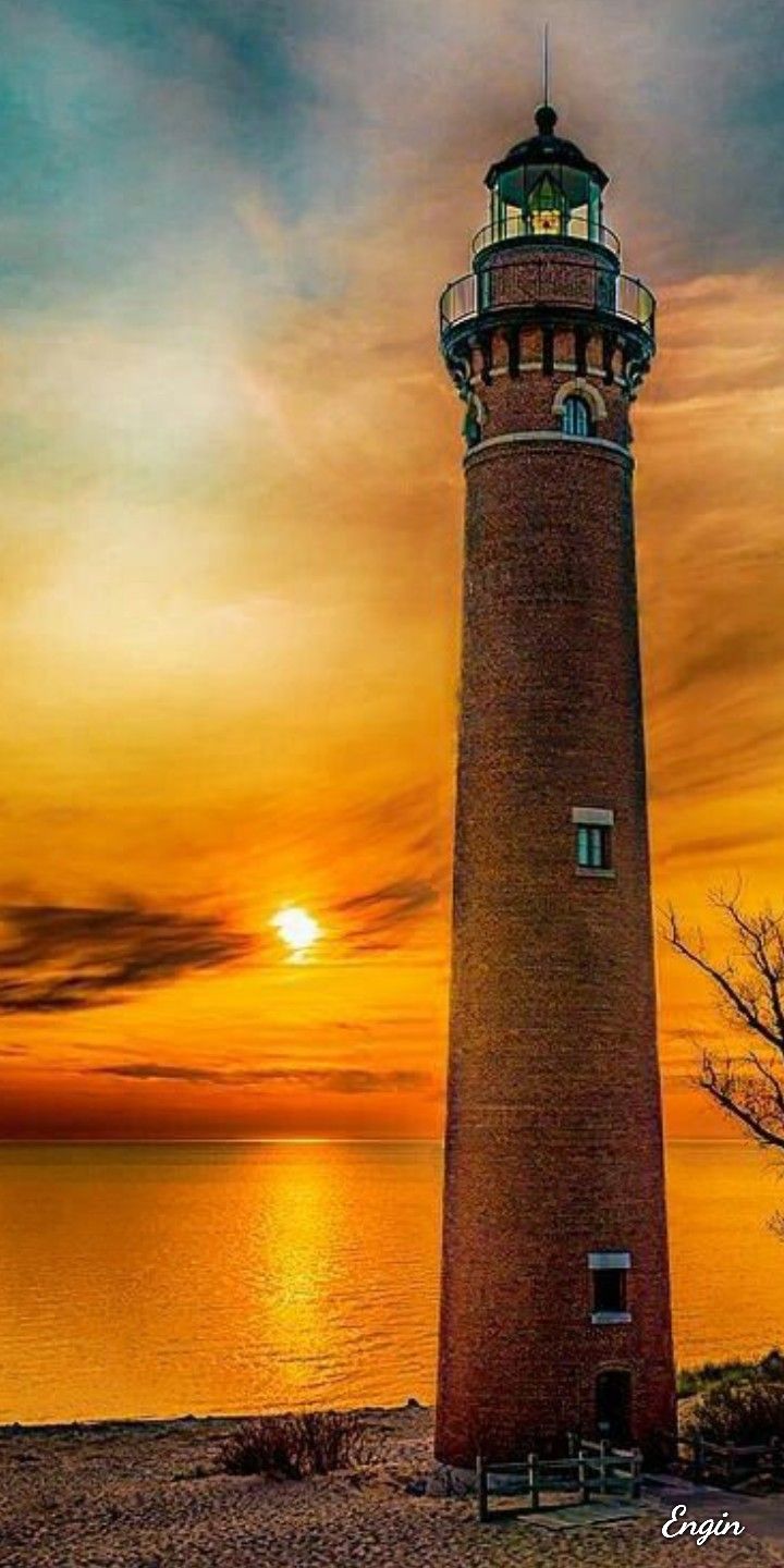 Yellow Sunset Near Lighthouse Wallpapers